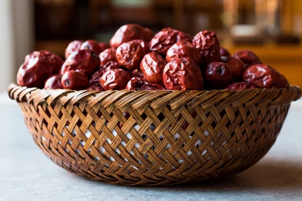 Red Jujube Fruits in Wooden Basket.