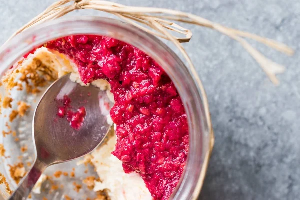 Forest Fruits Cheesecake in Jar with Spoon. / Unfinished Dessert — Stock Photo, Image