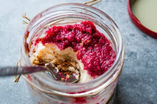 Forest Fruits Cheesecake in Jar with Spoon. / Unfinished Dessert — Stock Photo, Image