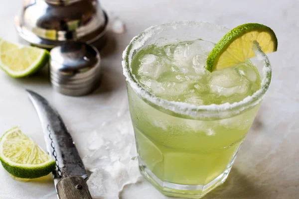 Classic Margarita Cocktail in Salted Glass with Lime and Crushed ice