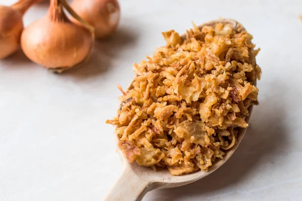 Fried Crispy Onion Flakes with Wooden Spoon — Stock Photo, Image