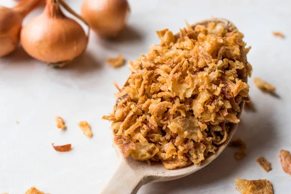 Fried Crispy Onion Flakes with Wooden Spoon — Stock Photo, Image