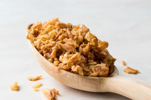 Fried Crispy Onion Flakes with Wooden Spoon — Stock Photo, Image