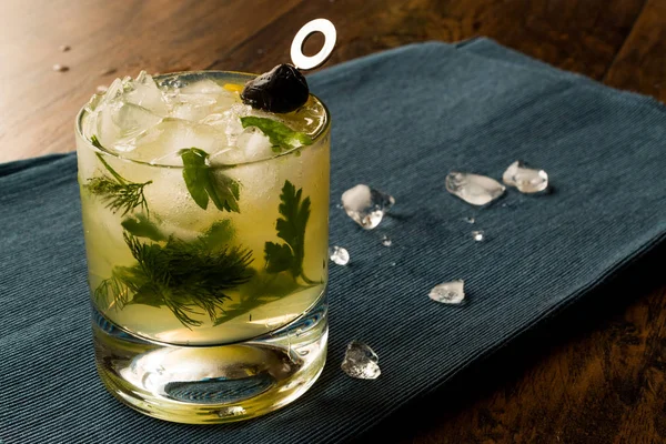 Dillionaire Cocktail with Dill, Gin, Parsley, lemon, Olive and Crushed Ice. — Stok Foto
