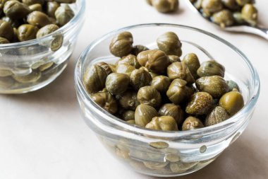 Edible Capers in Glass Bowl Ready to Eat. clipart