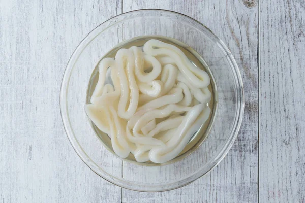 Raw Calamari Squid Rings in Water with Glass Bowl. — Stock Photo, Image