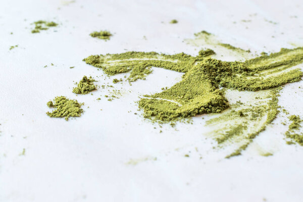 Green Matcha Tea Powder on Marble Surface