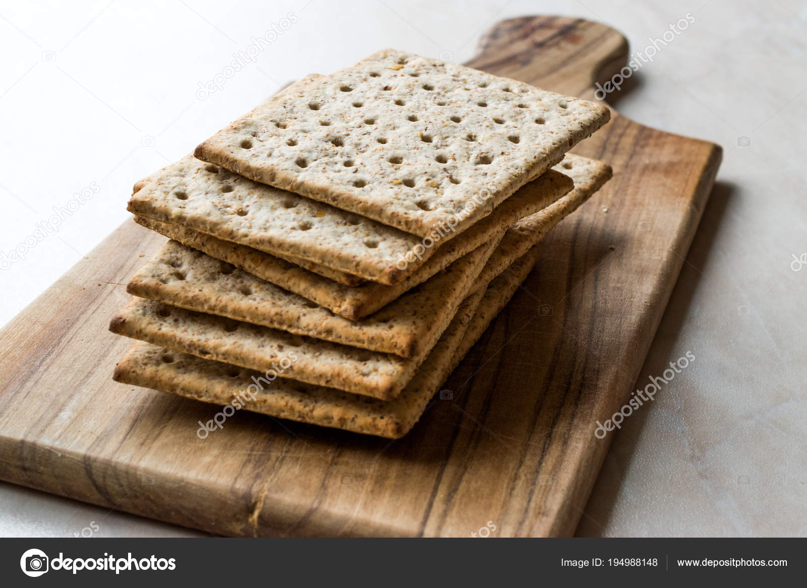 Stack of Honey Flavored Graham Crackers on Wooden Surface. Stock Photo