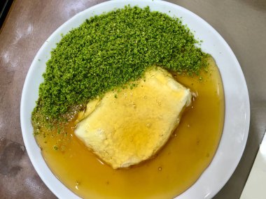 Turkish Honey with Butter Cream and Pistachio Powder / Bal Kaymak. Organic Food.