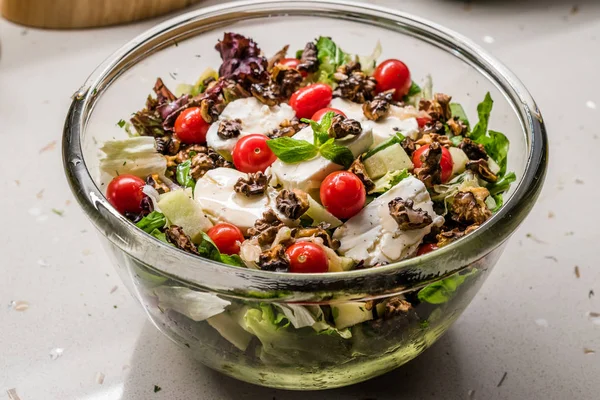 Goat Cheese Salad with Roasted Walnuts,  Cherry Tomatoes and Diced Apple Cubes. Organic Fresh Food.