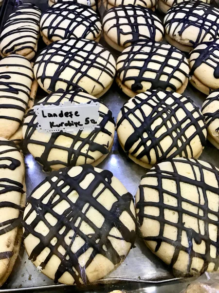 Turkish Big Sweet Cookies Landese with Marmalade Jam and Chocolate Sauce at for Sale at Local Patisserie. Traditional Sweet Snacks.