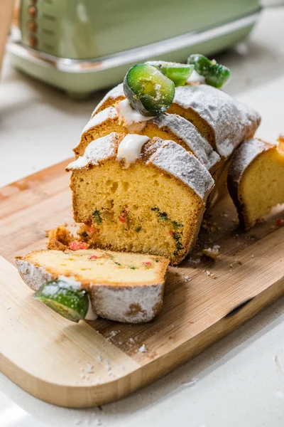 Fig Cake with Jelly Fruits and Powdered Sugar on Wooden Board. Ready to Serve.