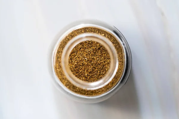 Powdered Coriander Powder in Glass Spice Jar / Cilantro. Organic Food.