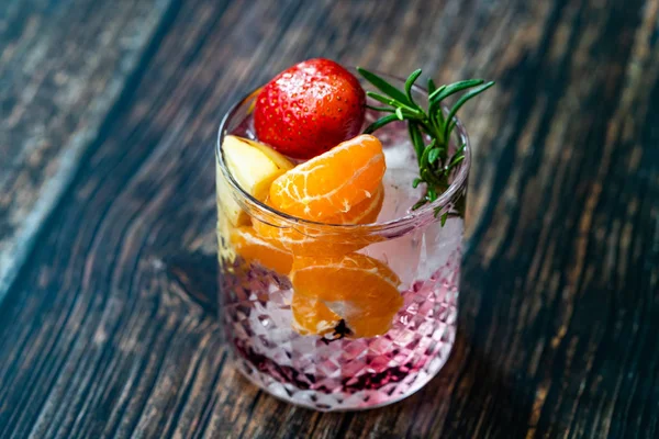 Fruit Cocktail with Strawberry, Mandarin, Apple and Rosemary / Fresh Pink Punch Beverage. Summer Drink. — Stock Photo, Image