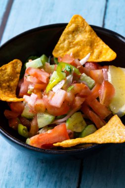 Mexican Food Pico De Gallo Salsa Salad with Tortilla Nachos, Tomato, Onion, Lime, Cilantro, Parsley, Jalapeno Pepper. Healthy Organic Traditional Food.