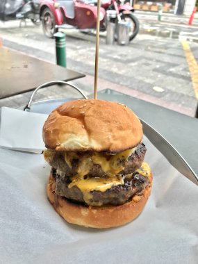 Street Food Hamburger with Double Patties / Cheeseburger. Fast Food.