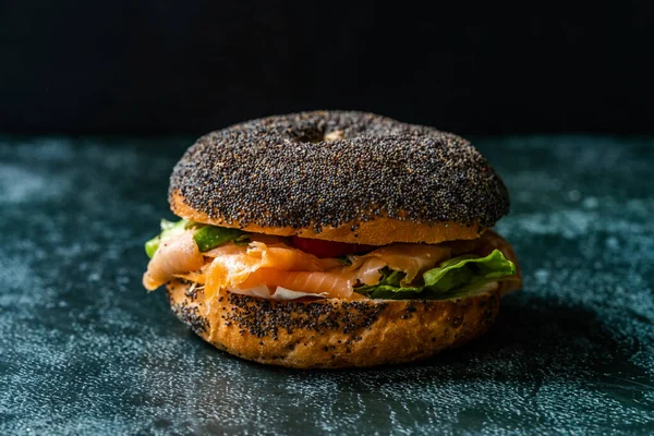 Salmon Bagel Sandwich with Lox Cream Cheese and Poppy Seeds. Organic Healthy Fast Food.