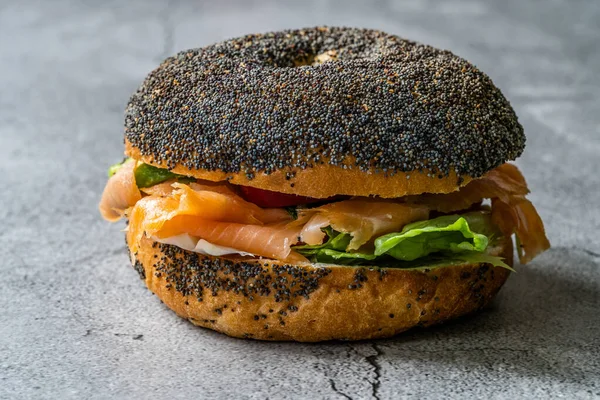 Salmon Bagel Sandwich with Lox Cream Cheese and Poppy Seeds. Organic Healthy Fast Food.