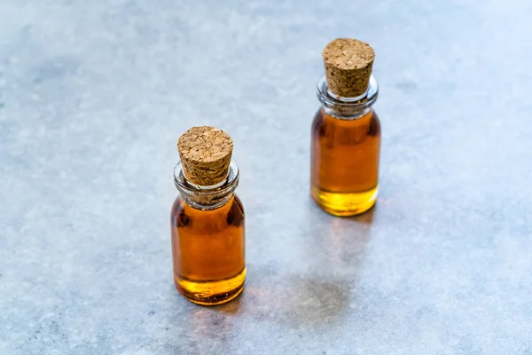 Homemade Organic Maple Syrup in Small Mini Glass Bottles with Corks Ready to Use.