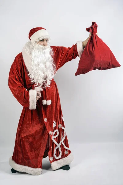 Kerstman met een zak met geschenken — Stockfoto