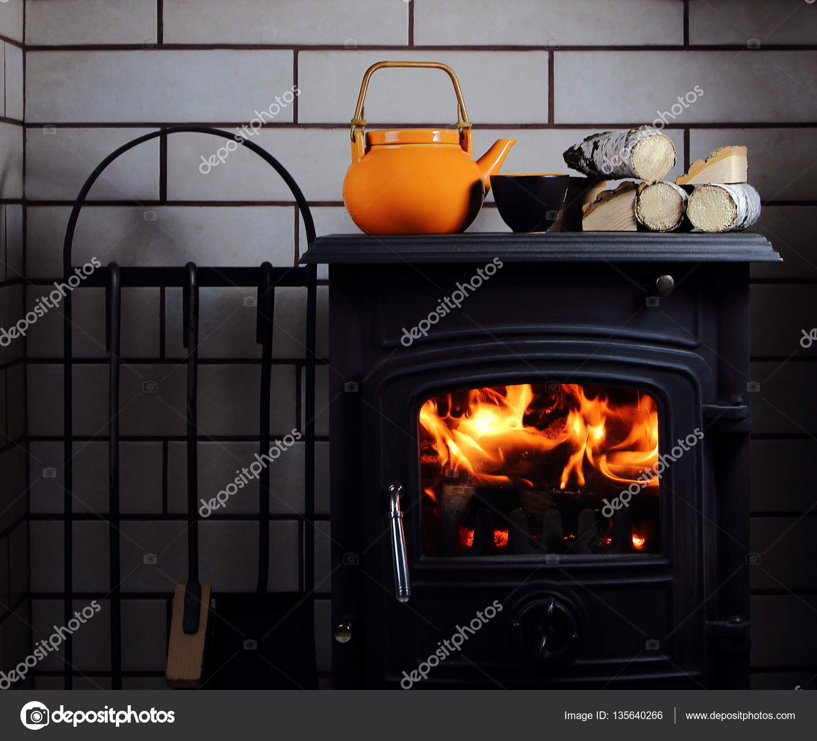 Kettle And Cup Of Tea On The Fireplace Stock Photo C Lenakorzh