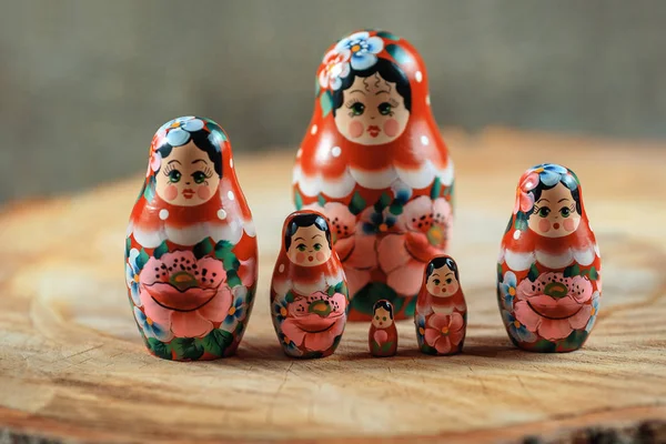 Matryoshka family. Russian doll on a wooden table.