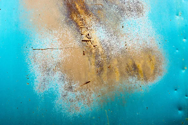 abstract background of vintage car door with rust and faded colors of brown and turquoise