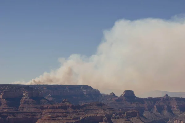 huge wildfire and some in the sky in the Grand Canyon National Park in the Arizona desert