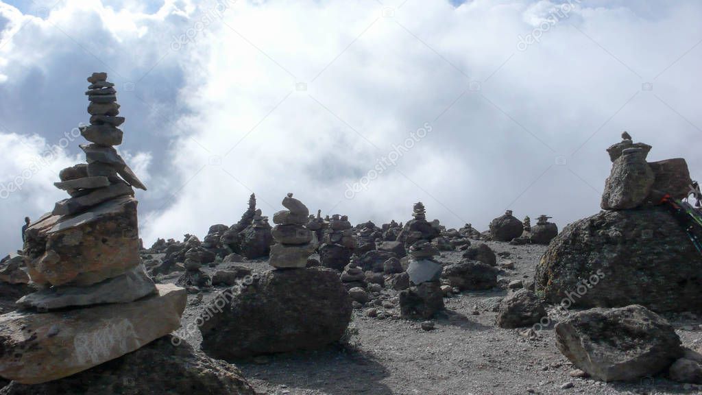 collection of rock cairns on the way to the summit of Kilimanjaro