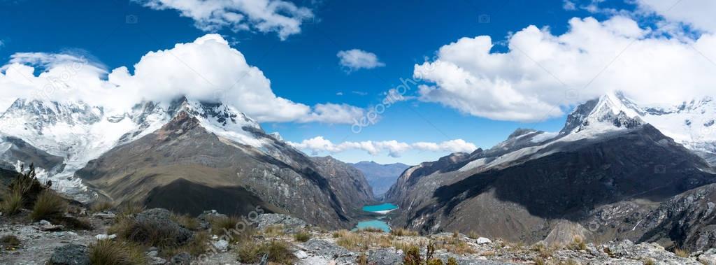 panorama view of the mountain landscape of the Llanganuco Valley with its turquoise mountain lakes and snow-capped peaks in the Cordillera Blanca in the Andes in Peru
