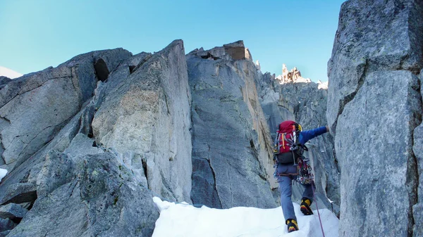 mountain climber on a steep north face route in Chamonix