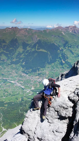 mountain climber on his way to the summit of Eiger mountain in the Swiss Alps