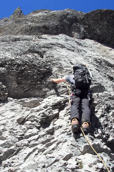 mountain climber on his way to the summit of Eiger mountain in the Swiss Alps