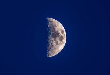 half moon in blue night sky clipart