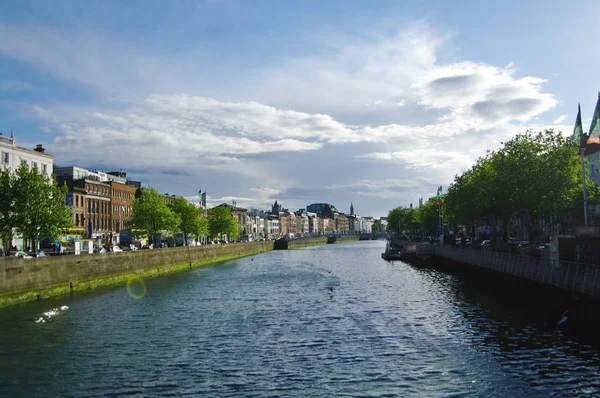 Liffey river crosses Dublin city, cloudy wheather