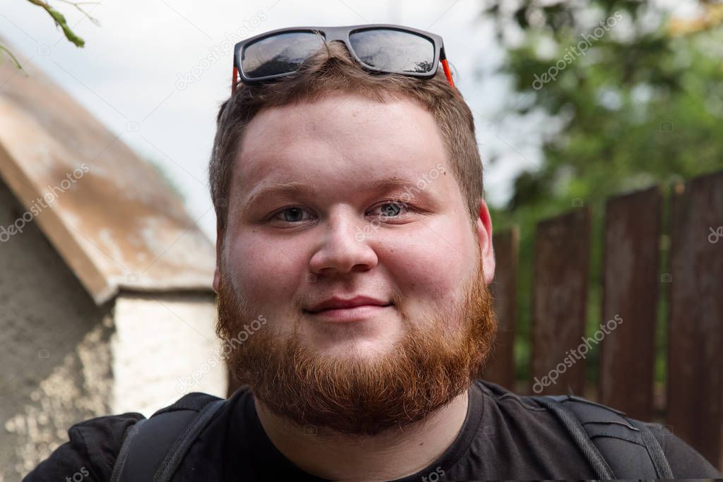 Young hipster red bearded Man.Fat young man with red hair.