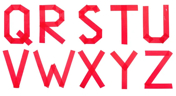 白い背景にスコッチテープからの英語のアルファベットの赤い文字のセット — ストック写真