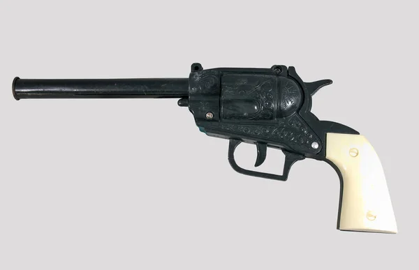 Ізольована біла / Пістолетна іграшка: вінтажна іграшка — стокове фото