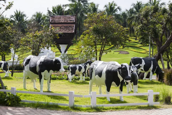 Garden with a statue of cow milk / statue of cow milk