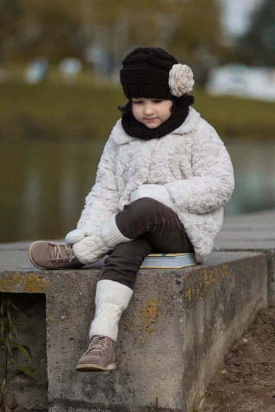 Little fashionable girl in warm clothes — Stock Photo, Image