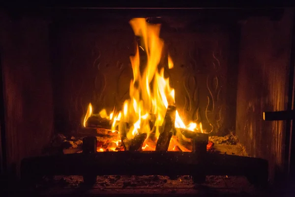 Orange flames of fire in fireplace — Stock Photo, Image
