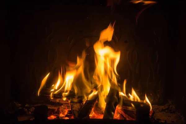 Orange flames of fire in fireplace — Stock Photo, Image