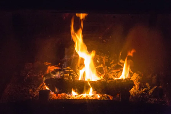 Fire flames with ash in fireplace — Stock Photo, Image