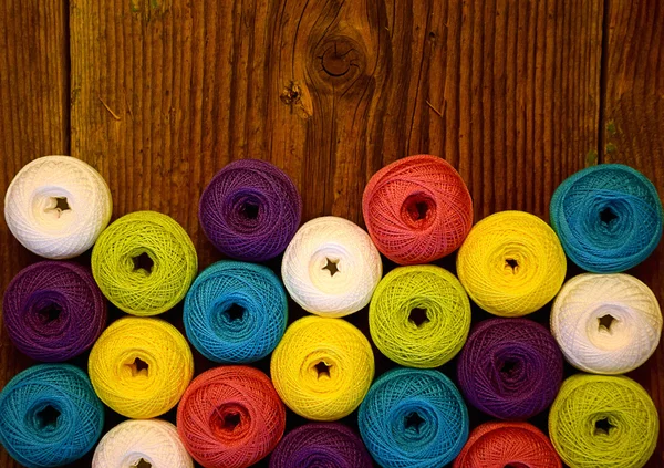 Crochet yarn balls on the old floor — Stock Photo, Image