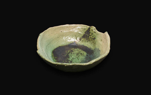 Ceramic flat plate on black background