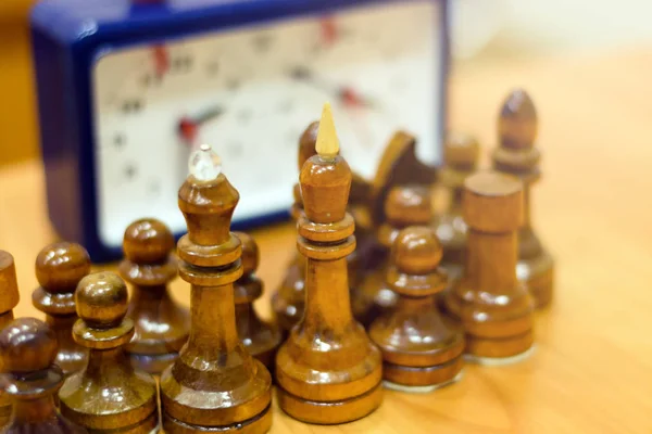 Black and white chess pieces on a chessboard, closeup. Set of chess figures on the playing board — Stock Photo, Image
