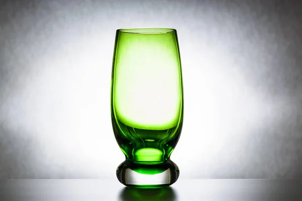 empty green glass tumbler, abstraction, concept of purity and loneliness