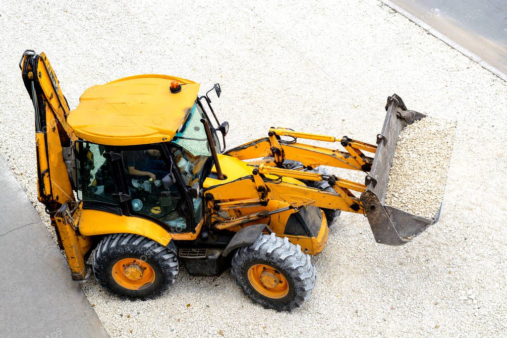 Yellow tractor leads road works