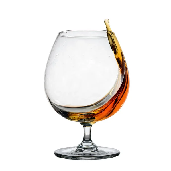 Isolated image of one glass of whiskey with splash — Stock Photo, Image