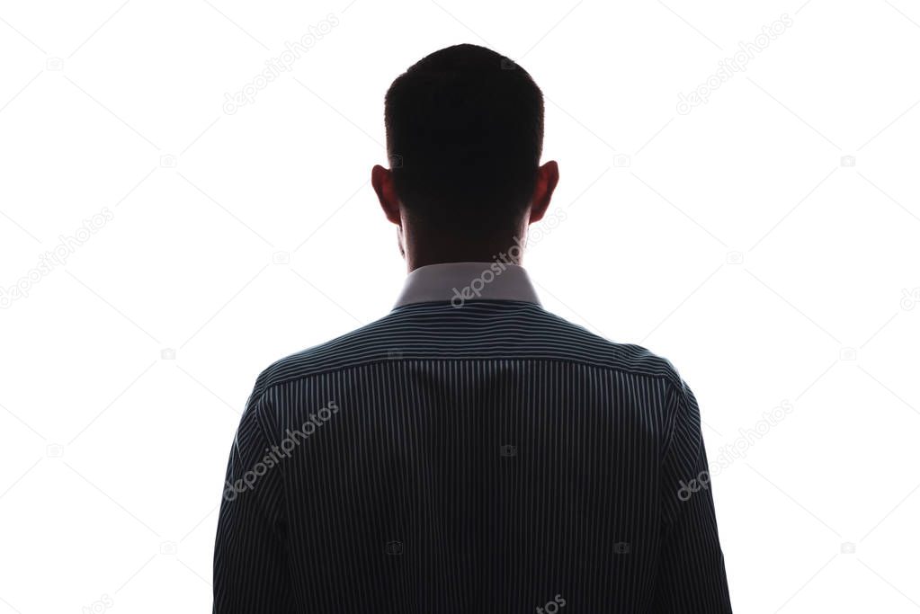 Silhouette of a man frontally from the back in a business shirt